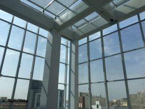 Are curved glass facade panels more expensive than regular ones?